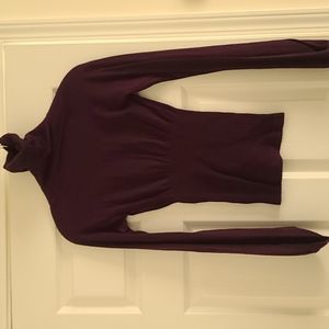 Bebe top with a slight balloon arm fitted at wrist